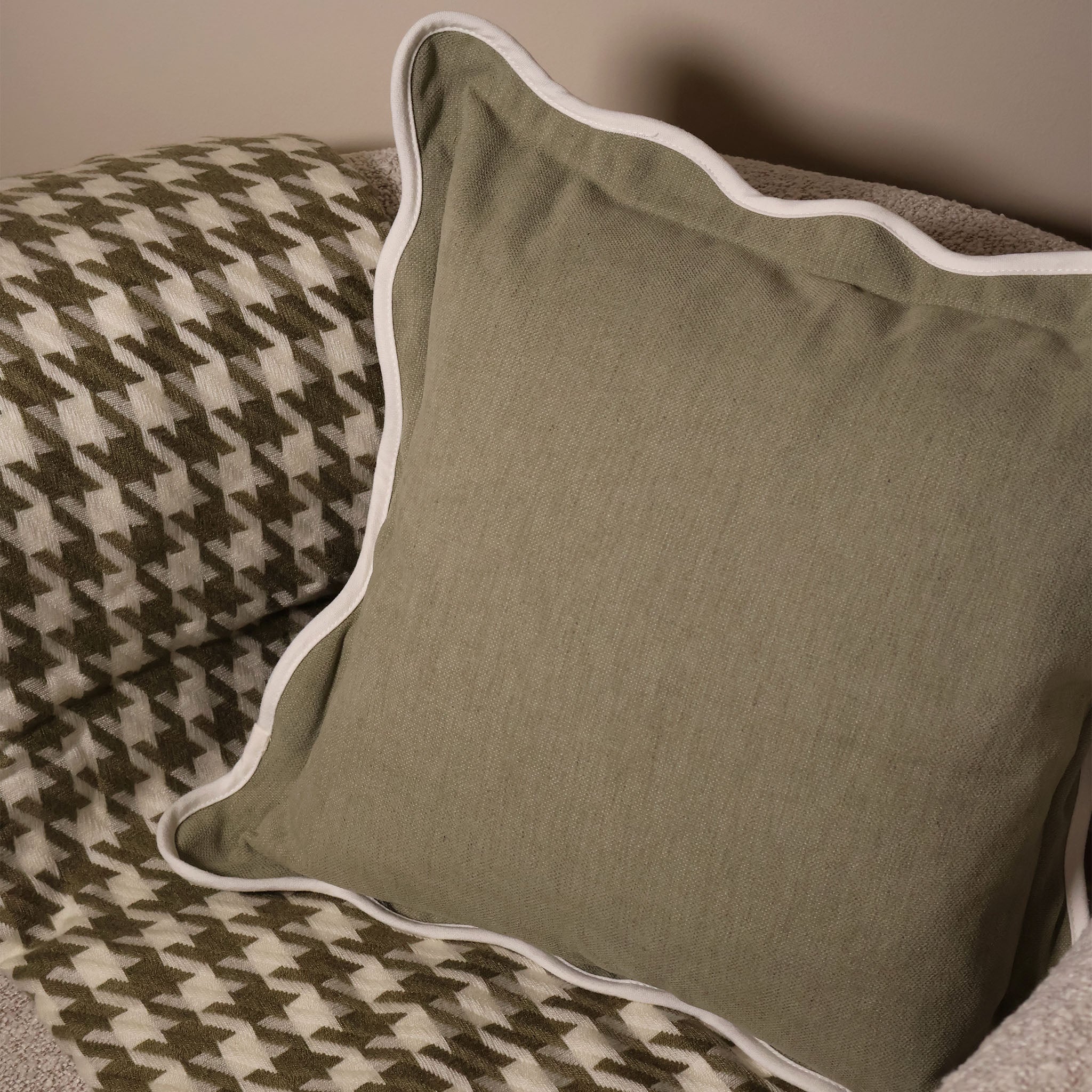 Olive and Cream Houndstooth throw paired with a square scalloped edge cushion